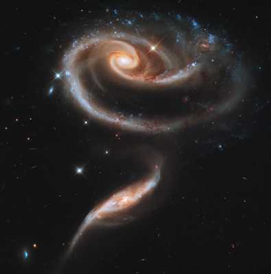 Arp 273 galaxies interacting in the shape of a rose.