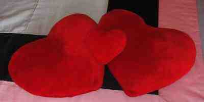 Three cushions of red hearts.